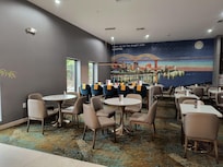Dining area has a cool art wall