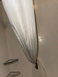 These are the shower curtains in the bathroom that were very dirty