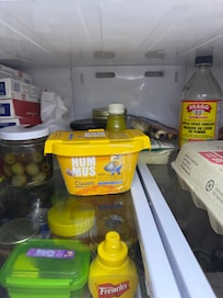 Old food and prescription ozempic needles in fridge