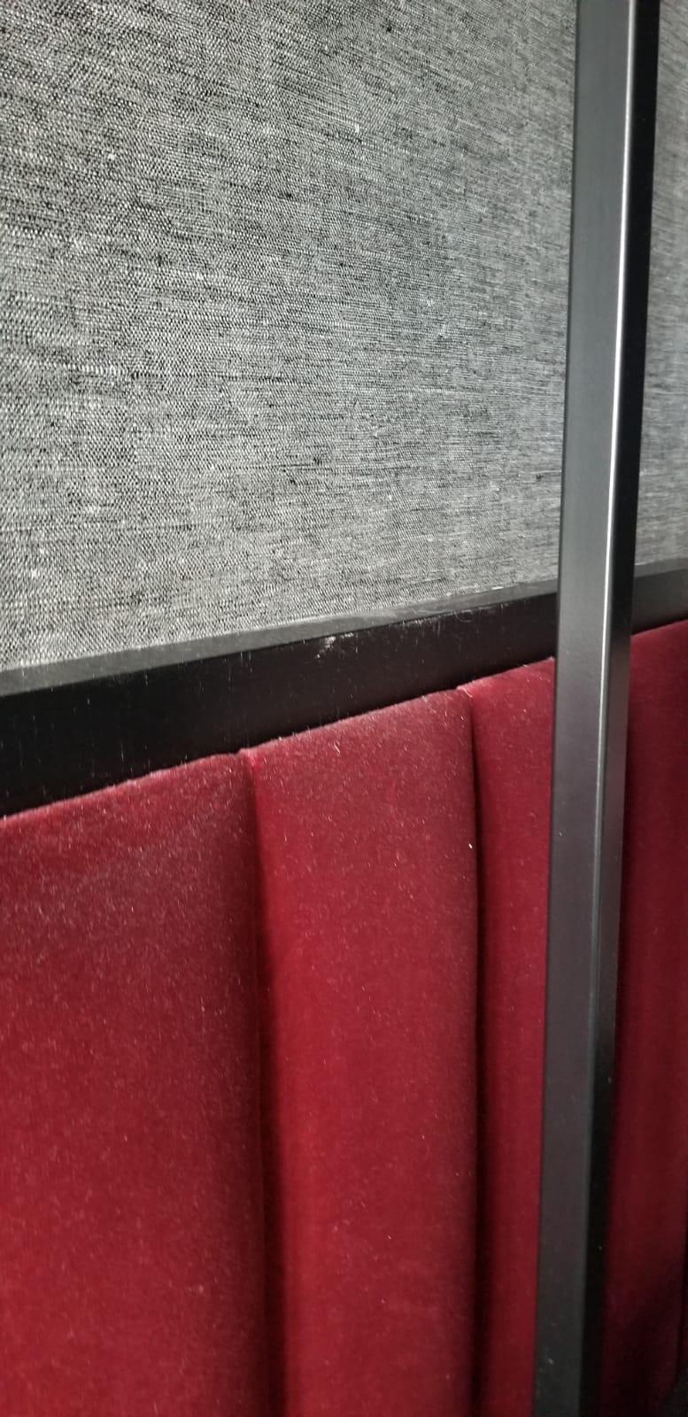 Bed head board. Look at the red suede...even with the dark color the dirt is still visible