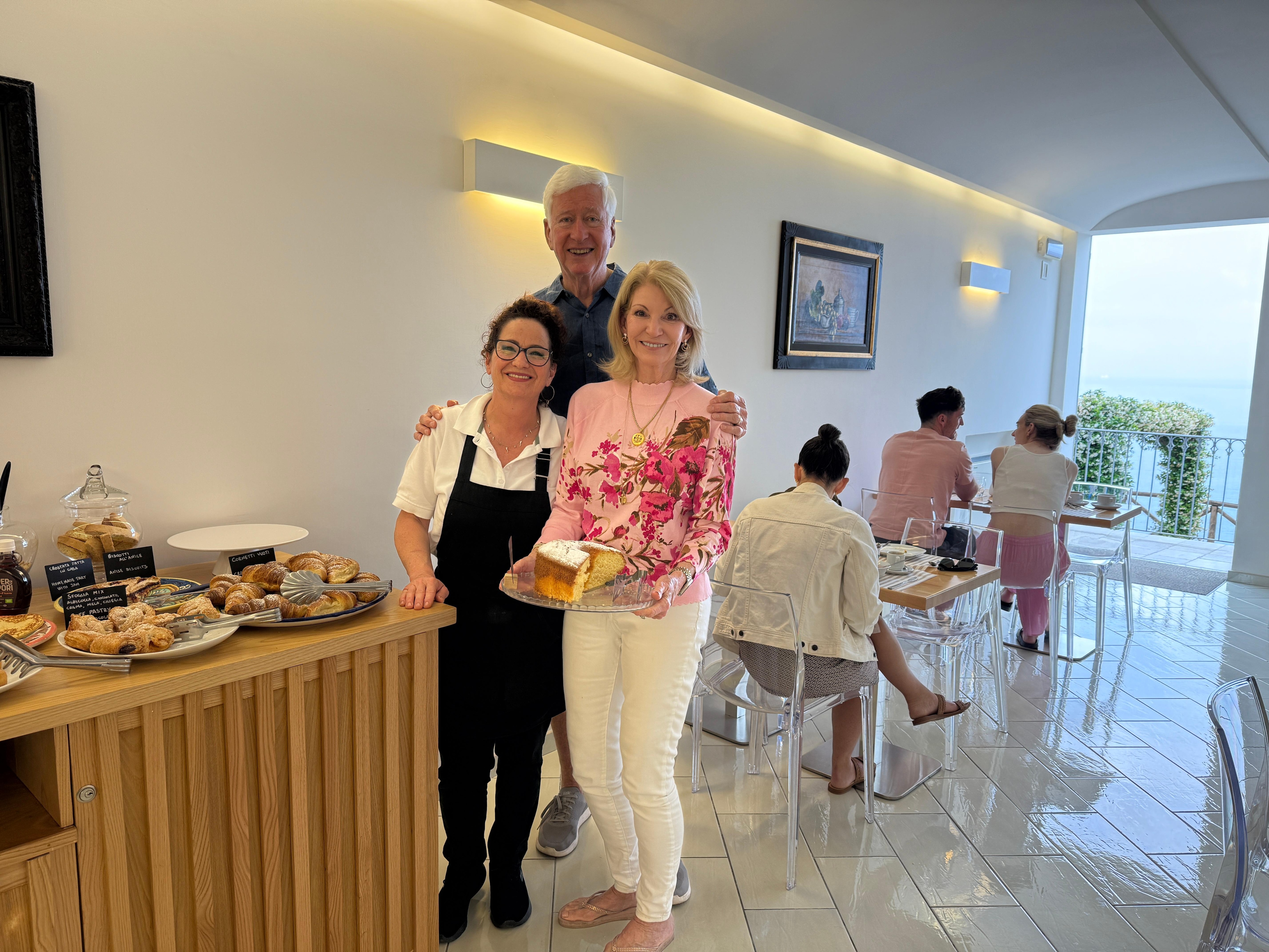 Patricia and one of her delicious homemade cakes!  She always greeted us with a BIG smile and a beautiful breakfast with many homemade treats.  