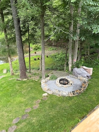 Firepit with ample dry firewood provided.