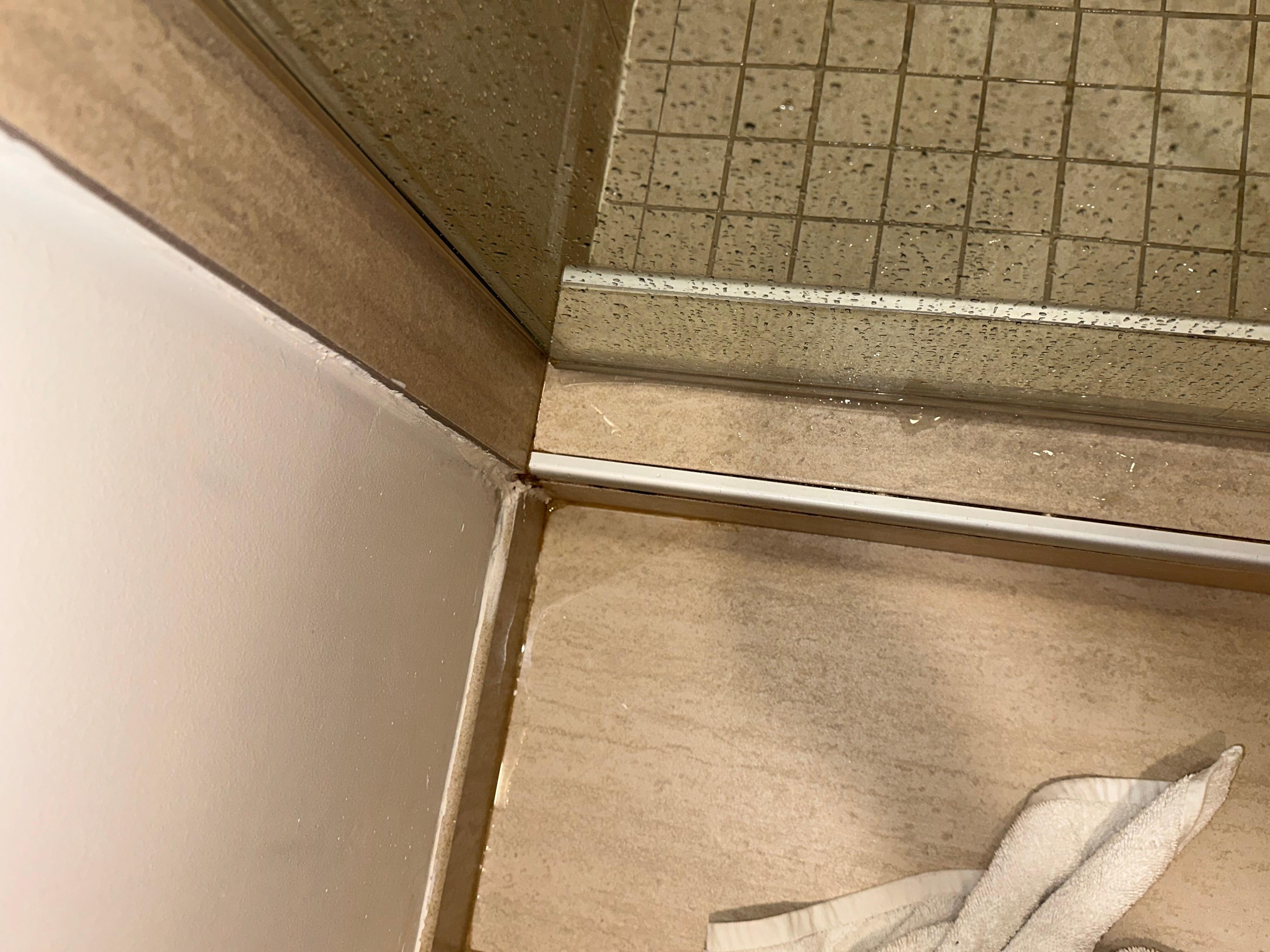 Bathroom floods when shower is used - clearly a regular problem from all the water damage present 