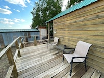 The deck on the side of the cabin.