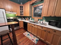 The kitchen was small but functional with cups/plates etc