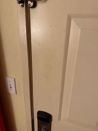 Front door was filthy with dirty smudges and fingerprints.