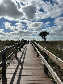 Walking down the boardwalk to the ocean.