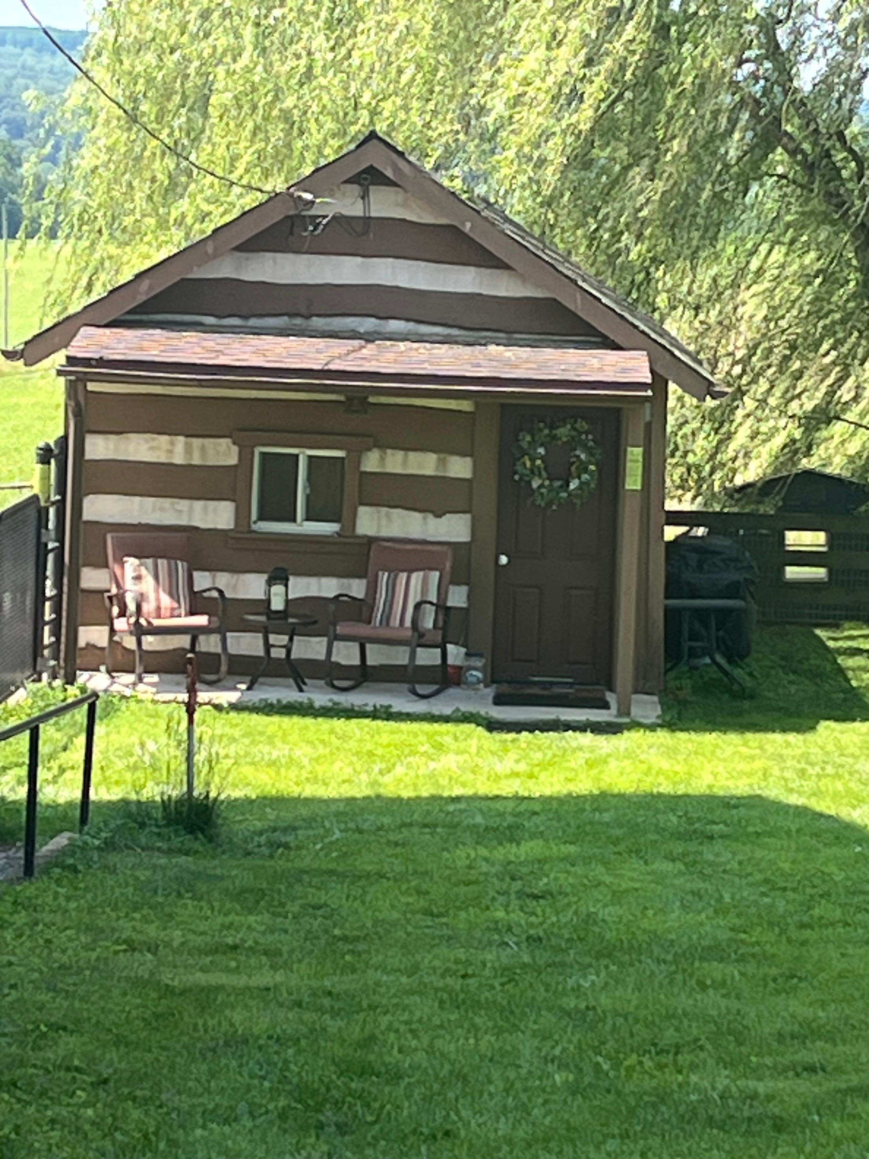 Cute cabin surrounded by nature, farm and animals 