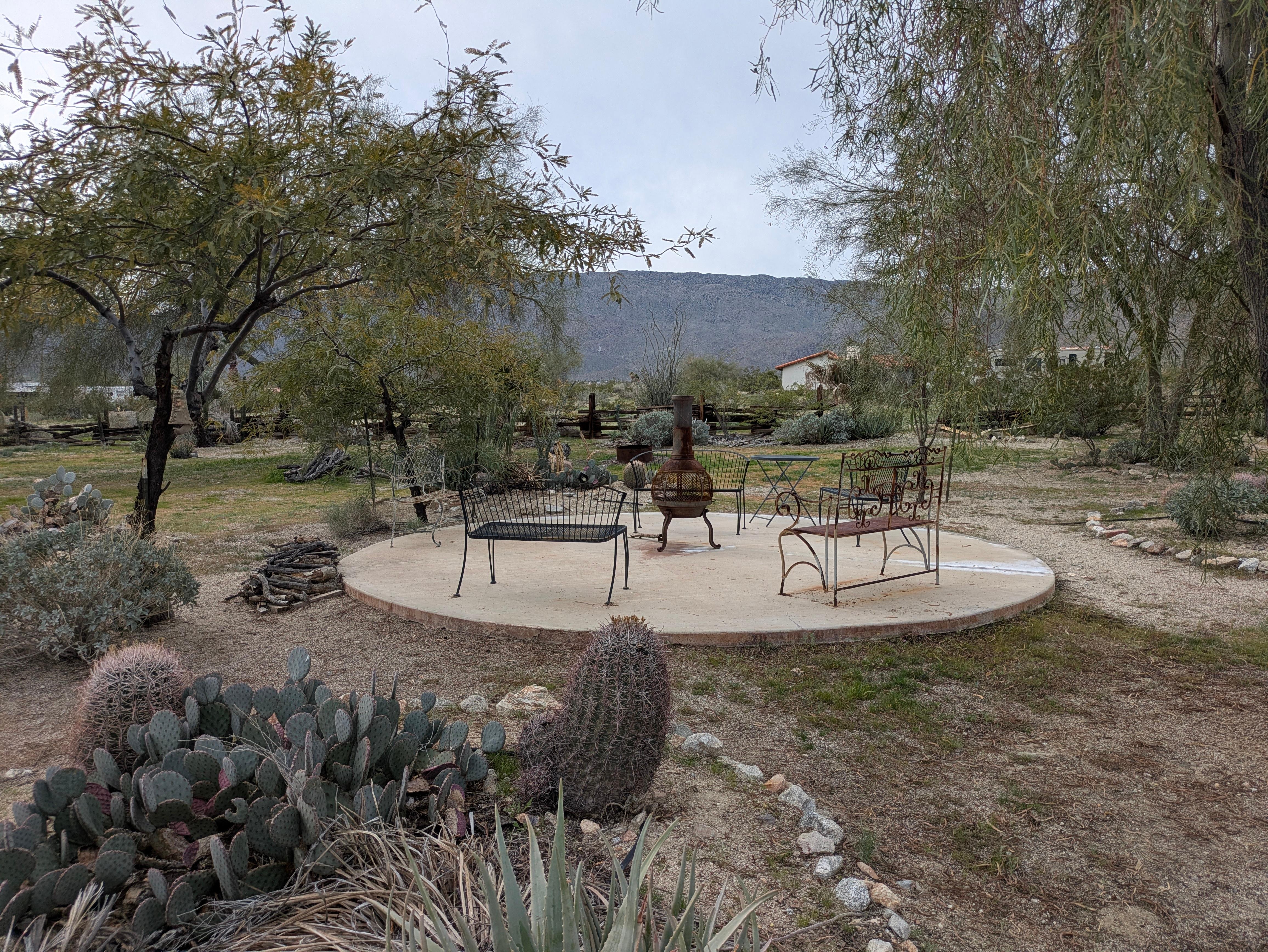 Patio and fireplace on the grounds.