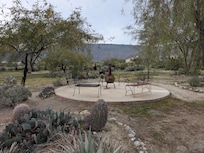 Patio and fireplace on the grounds.