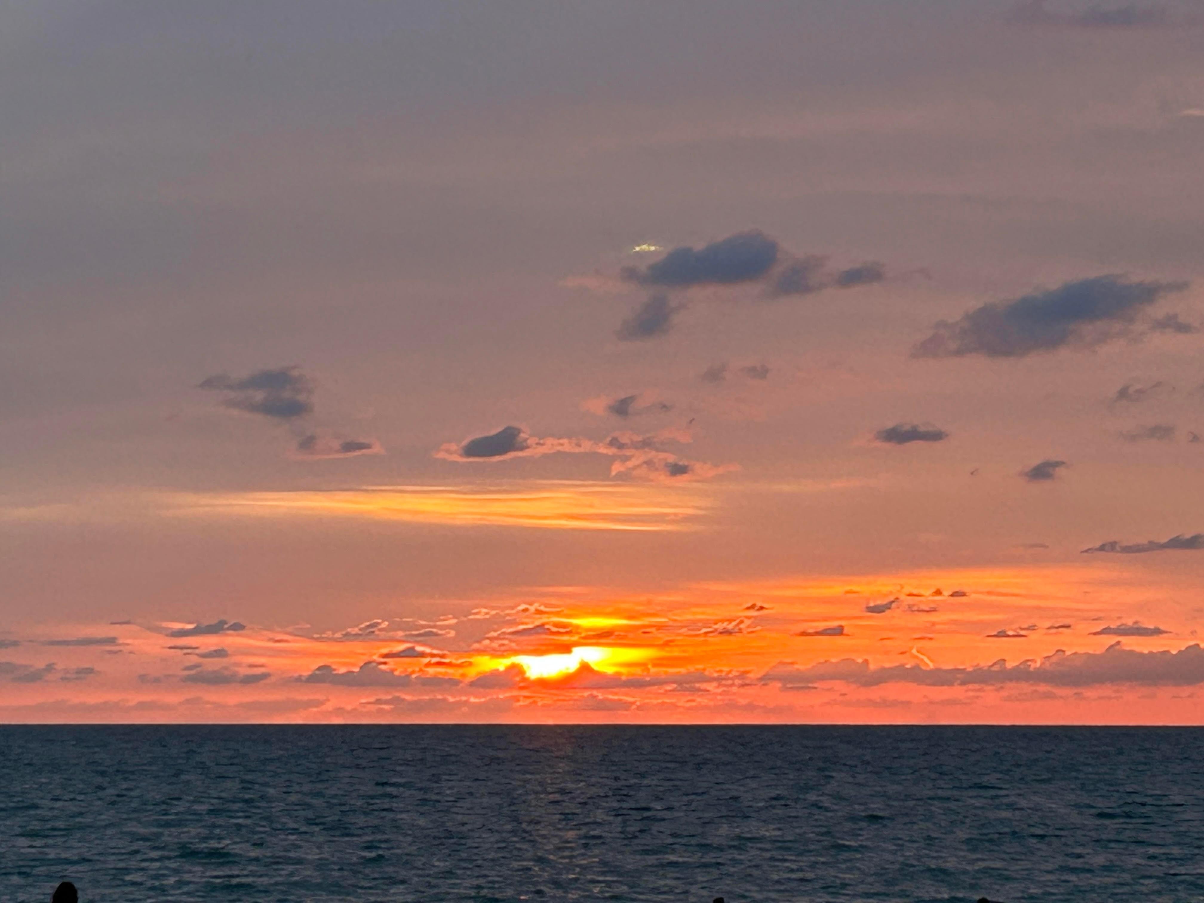 The sunset at the beach right outside our Villa.