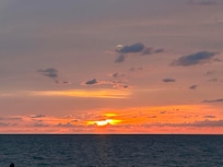The sunset at the beach right outside our Villa.