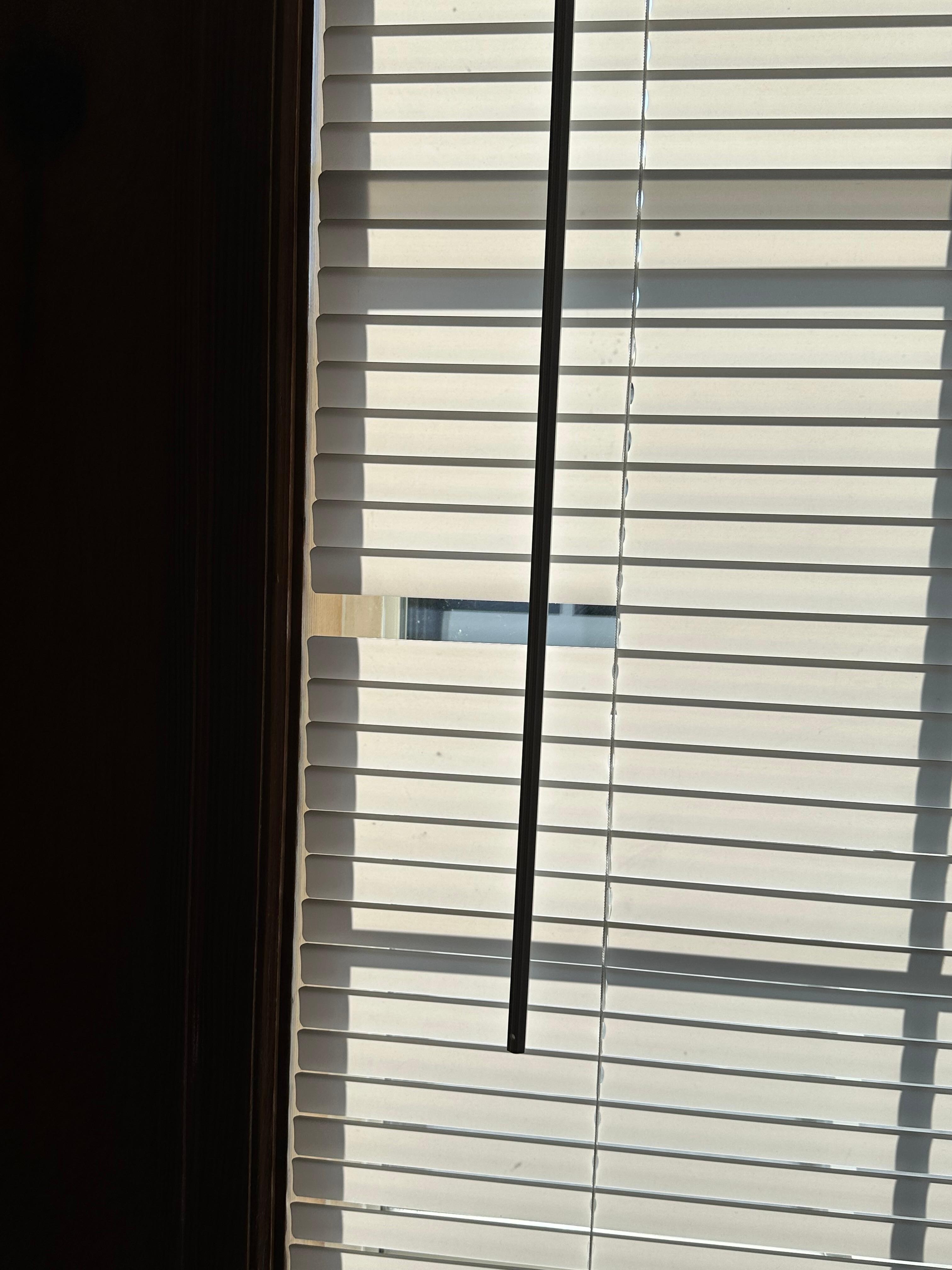 Broke blinds in living room