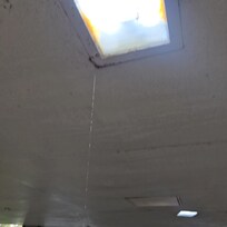 Water leaking out of light fixture in car park