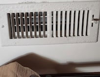 Condensation on vent with what looks like mold growth.