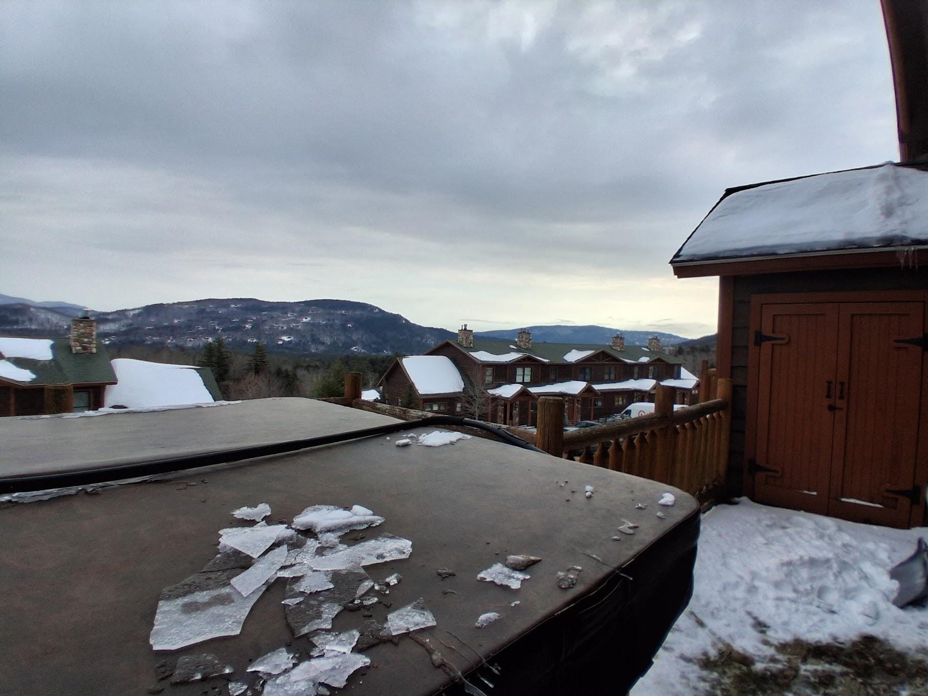 View from porch out back with hot tub.