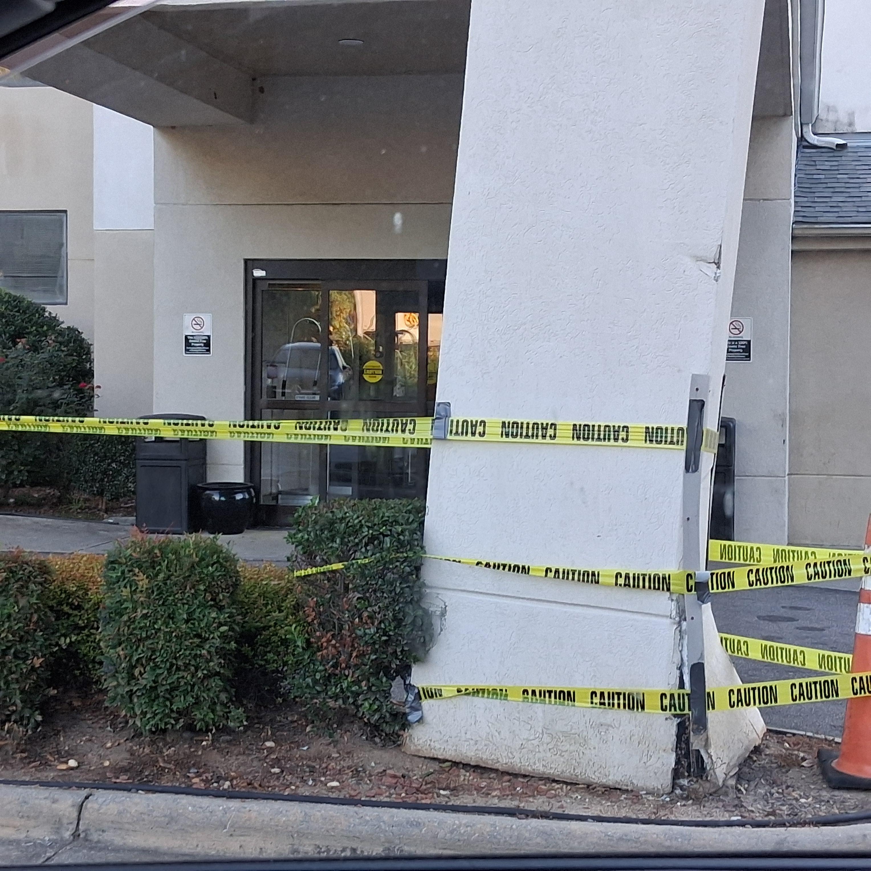 One of the legs that hold the roof over the front door up. (Please note there was only one other door (at the other end of the building) that was a fire door. This is the one way in and out.