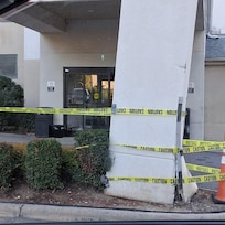 One of the legs that hold the roof over the front door up. (Please note there was only one other door (at the other end of the building) that was a fire door. This is the one way in and out.