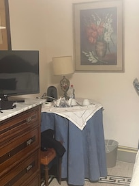 Tv, AC unit, kettle, & drink set up right in your room.