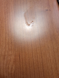 Sticky stuff on the end table. Hard to get a good photo due to glair from lamp