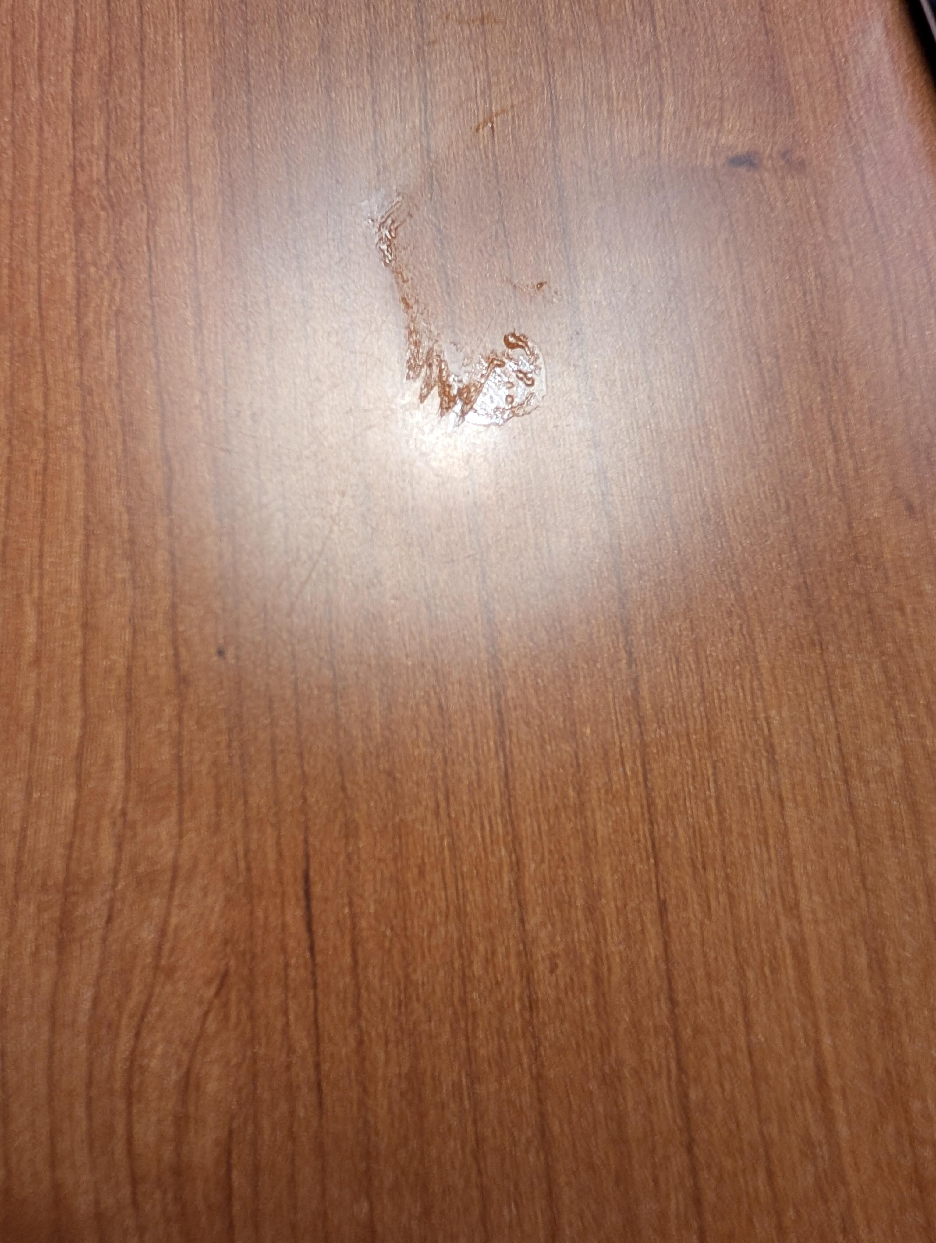 Sticky stuff on the end table. Hard to get a good photo due to glair from lamp