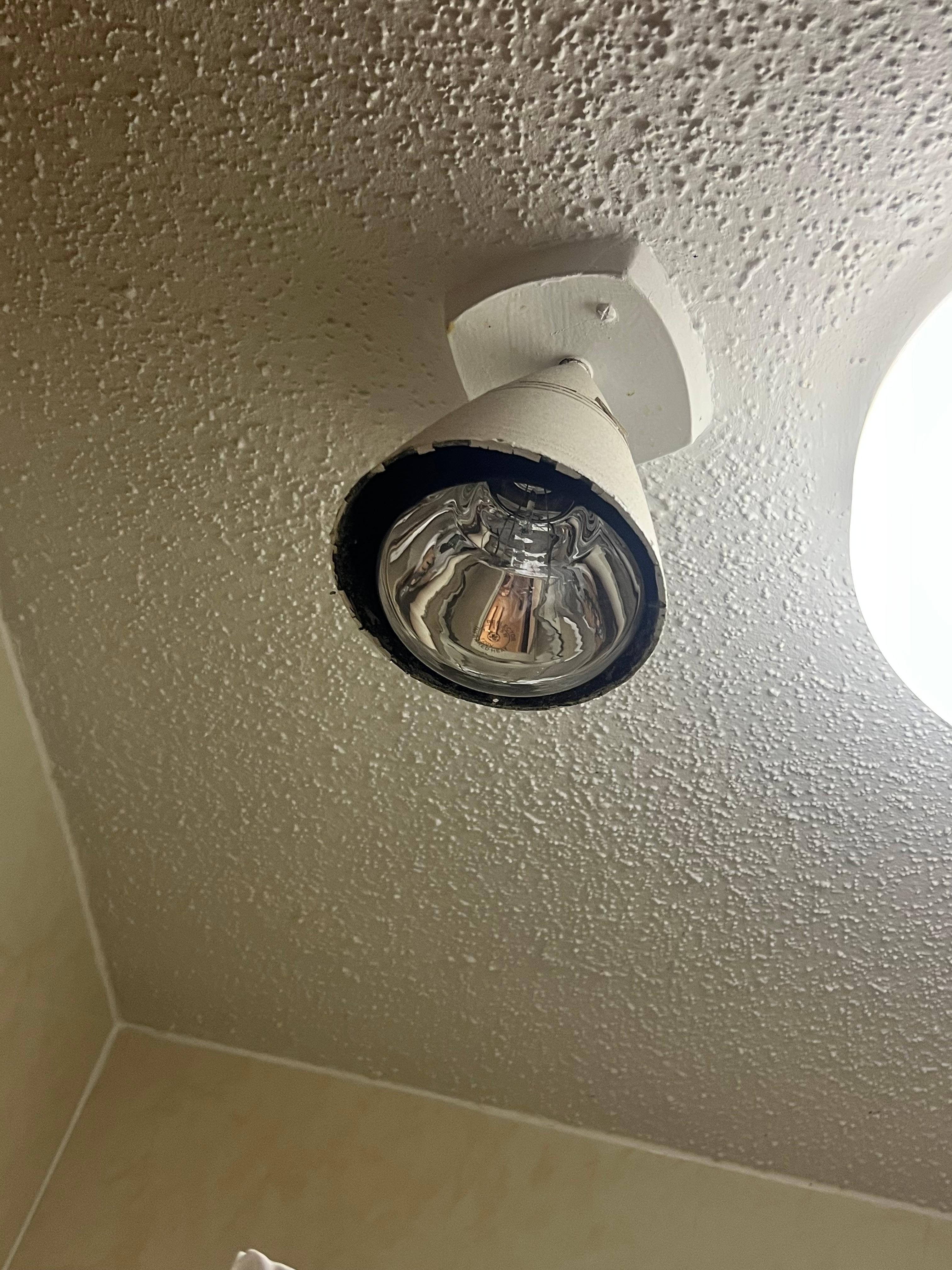 Rusty light right above shower