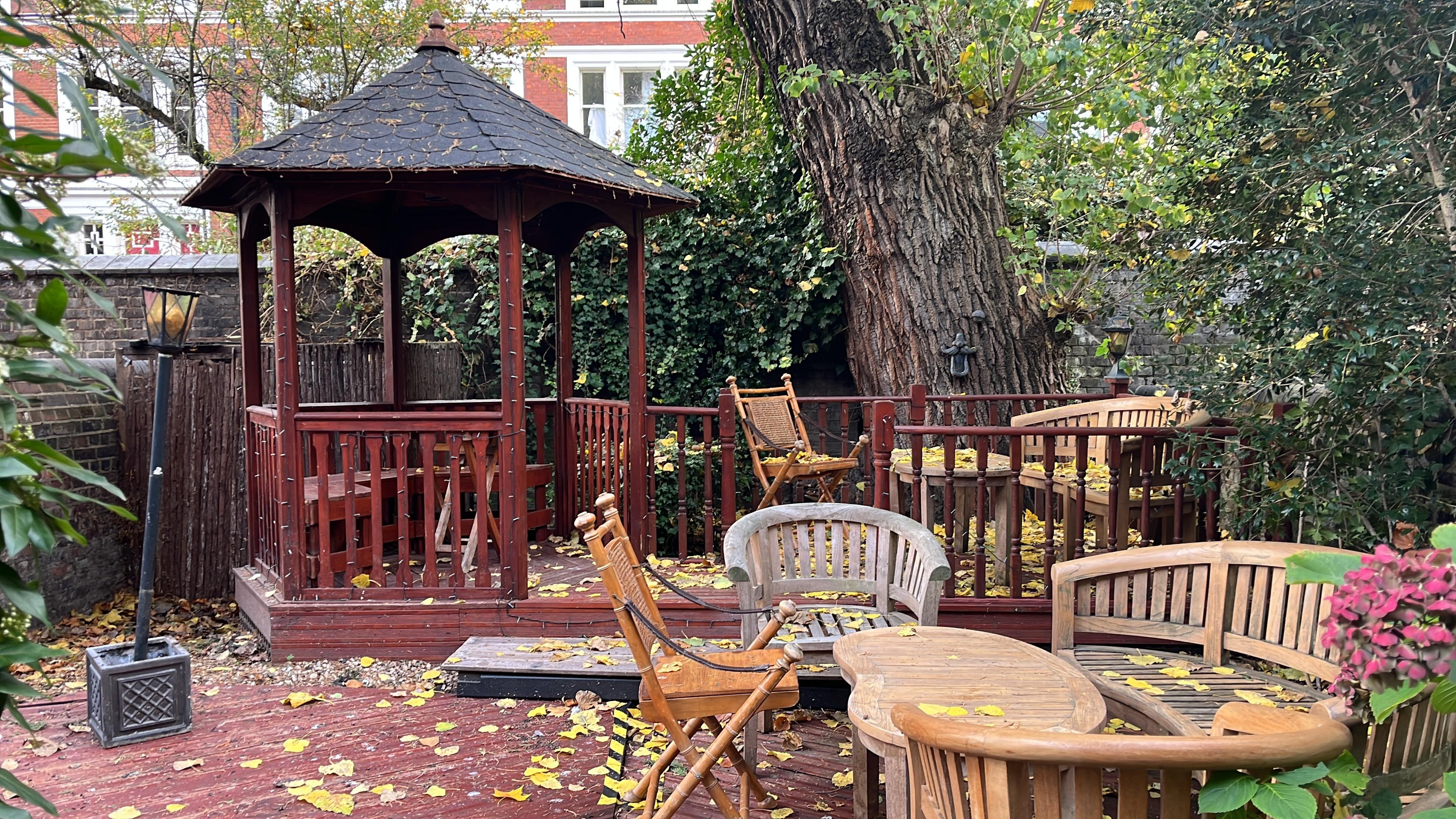 Outside sitting. In ill repair. Broken boards