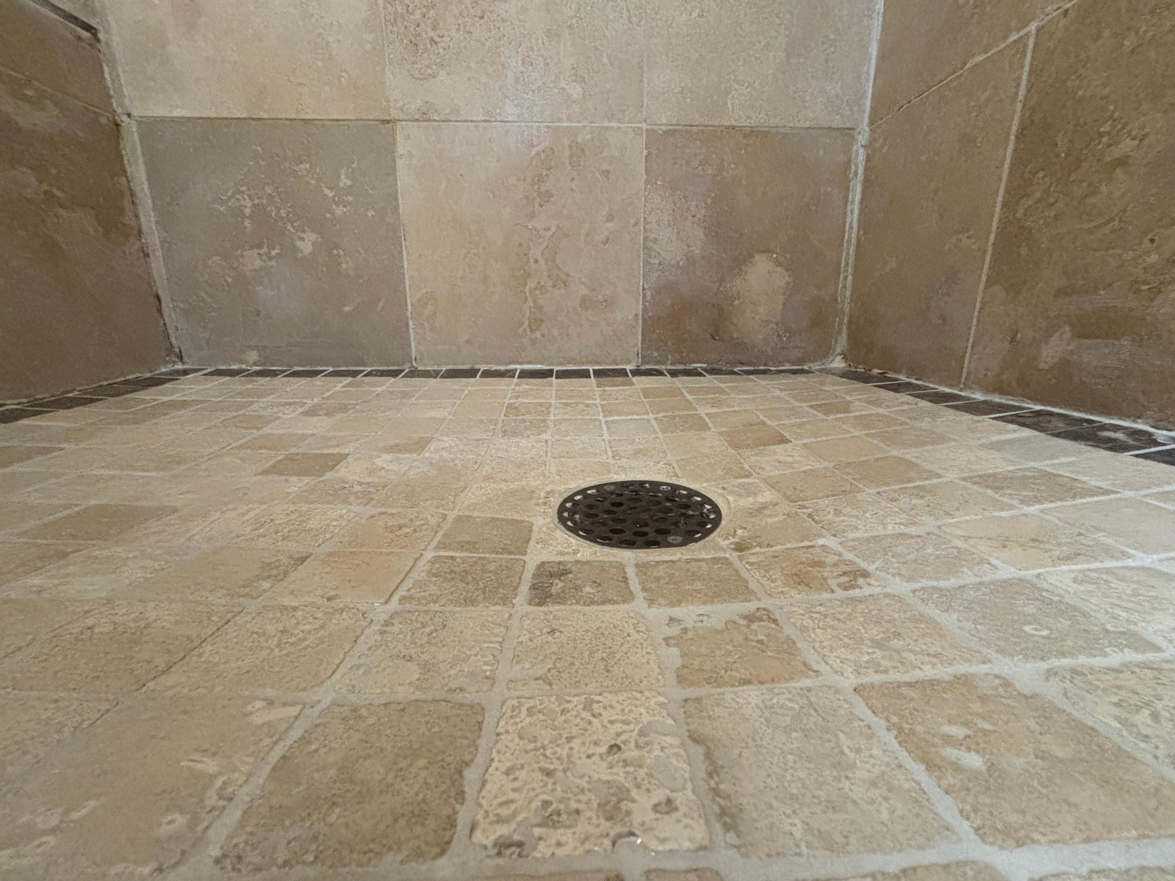 Aggressive shower pan slope. 