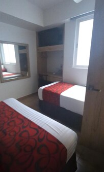 Single bed and bathroom door