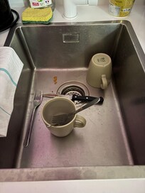 Dirty dishes in sink upon arrival