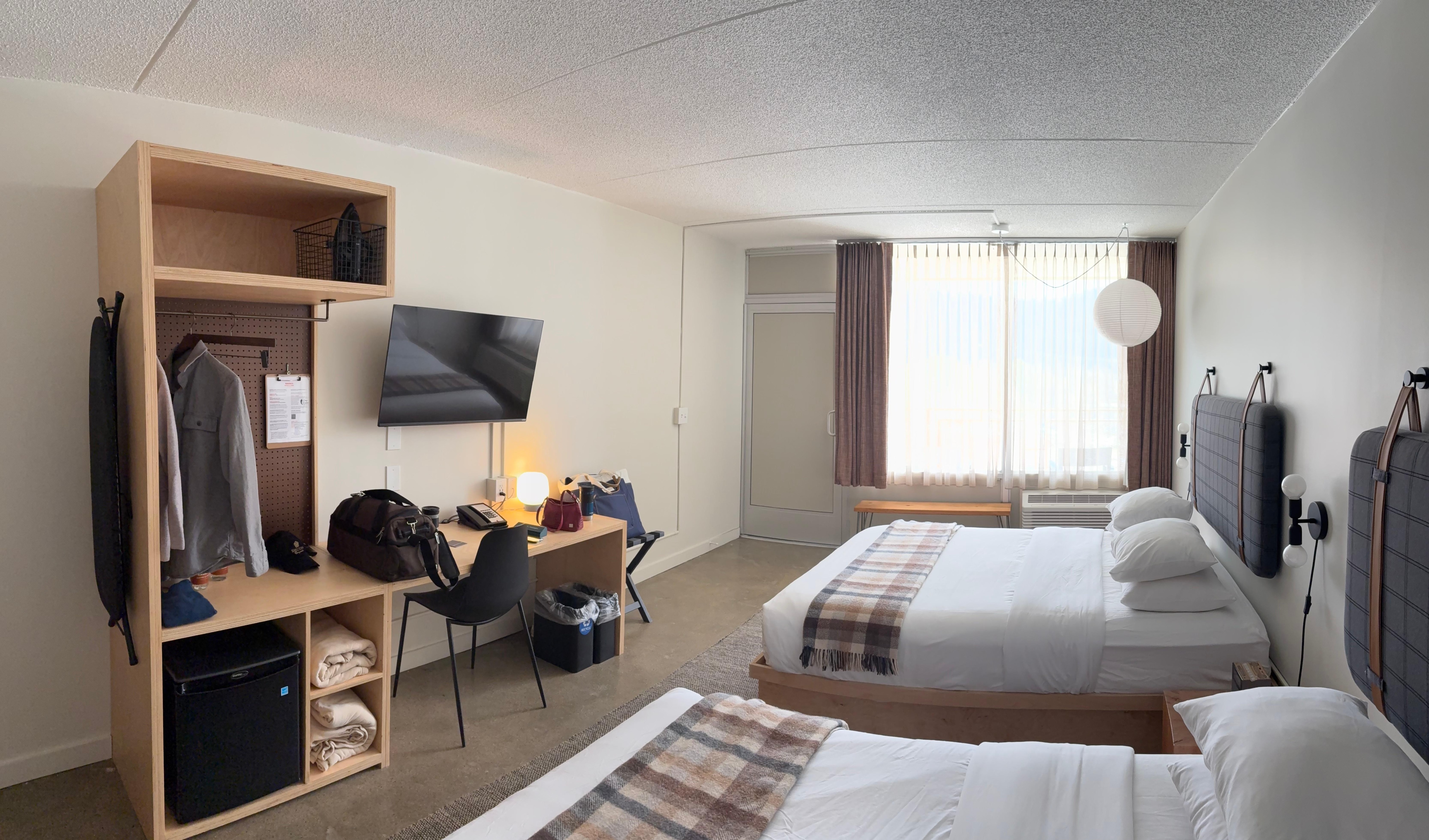 A double queen on third floor. The door next to the window, center left, leads out to a nice balcony with cool chairs and a solid wood block table.