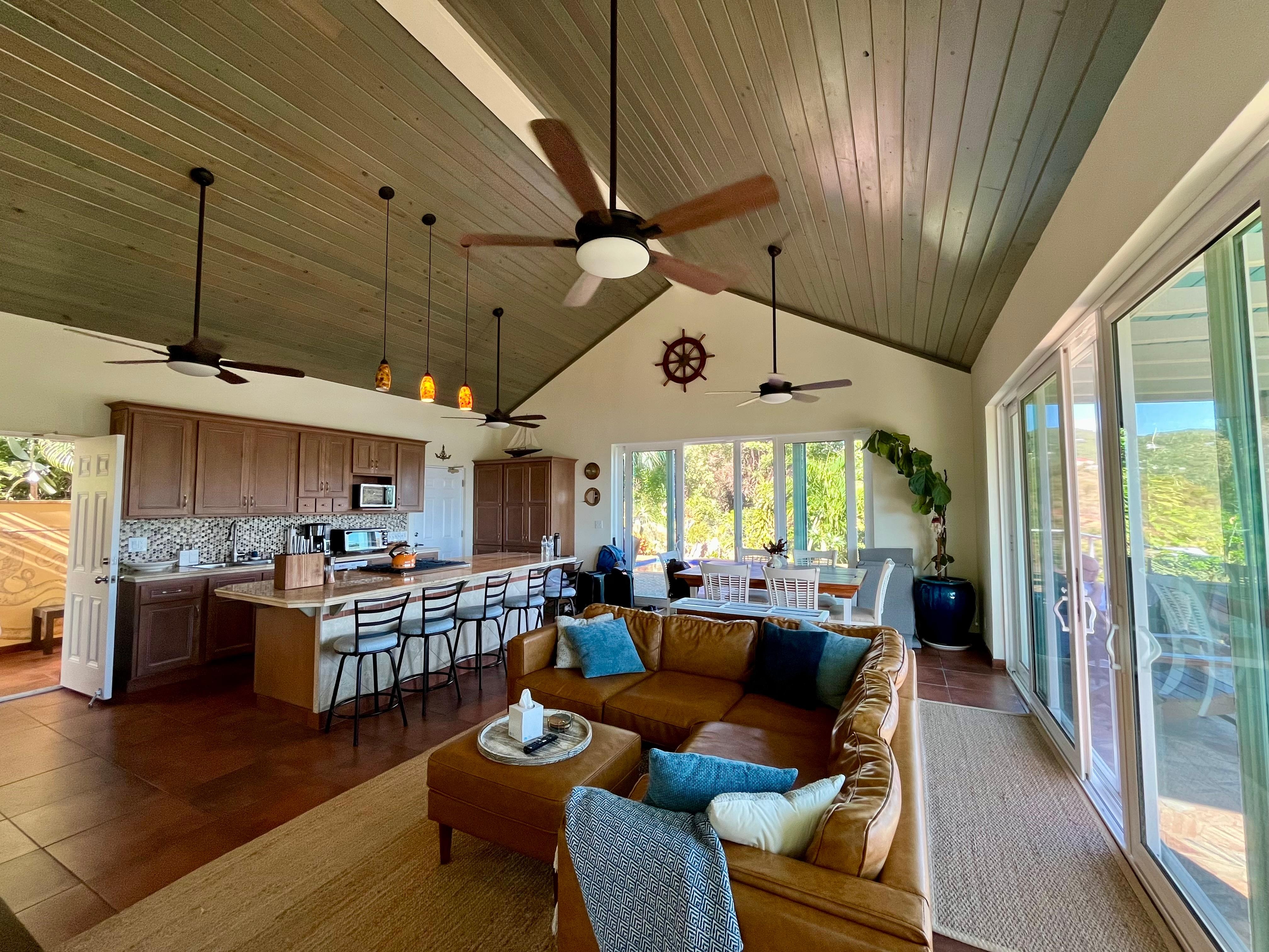 Main living area photo (shows door to the bathroom on the left, and two sets of sliding doors to the outside).