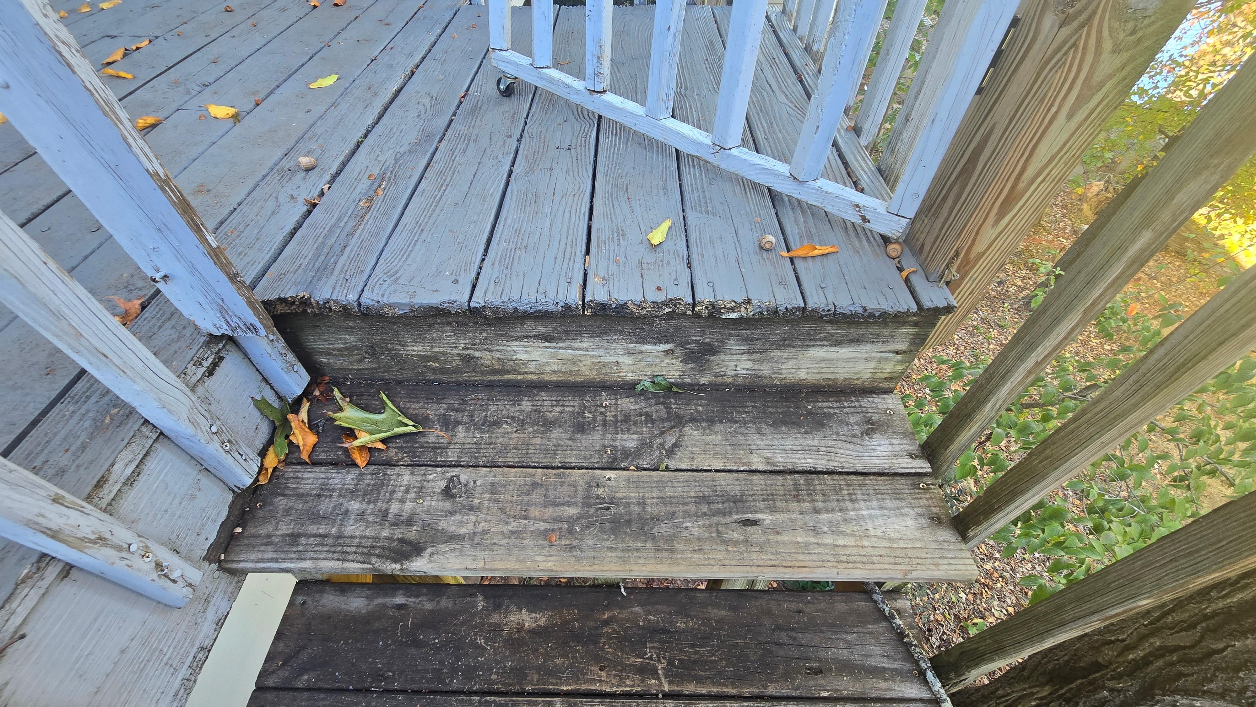 Rotting wood on the outdoor staircase, which is rickety and feels unsafe.