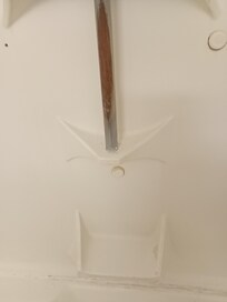 Rusty bathtub hand rail.