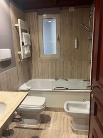 Bathroom- good size with shampoo and shower gel