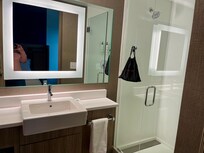 Great lighting in bathroom, clean roomy stand up shower