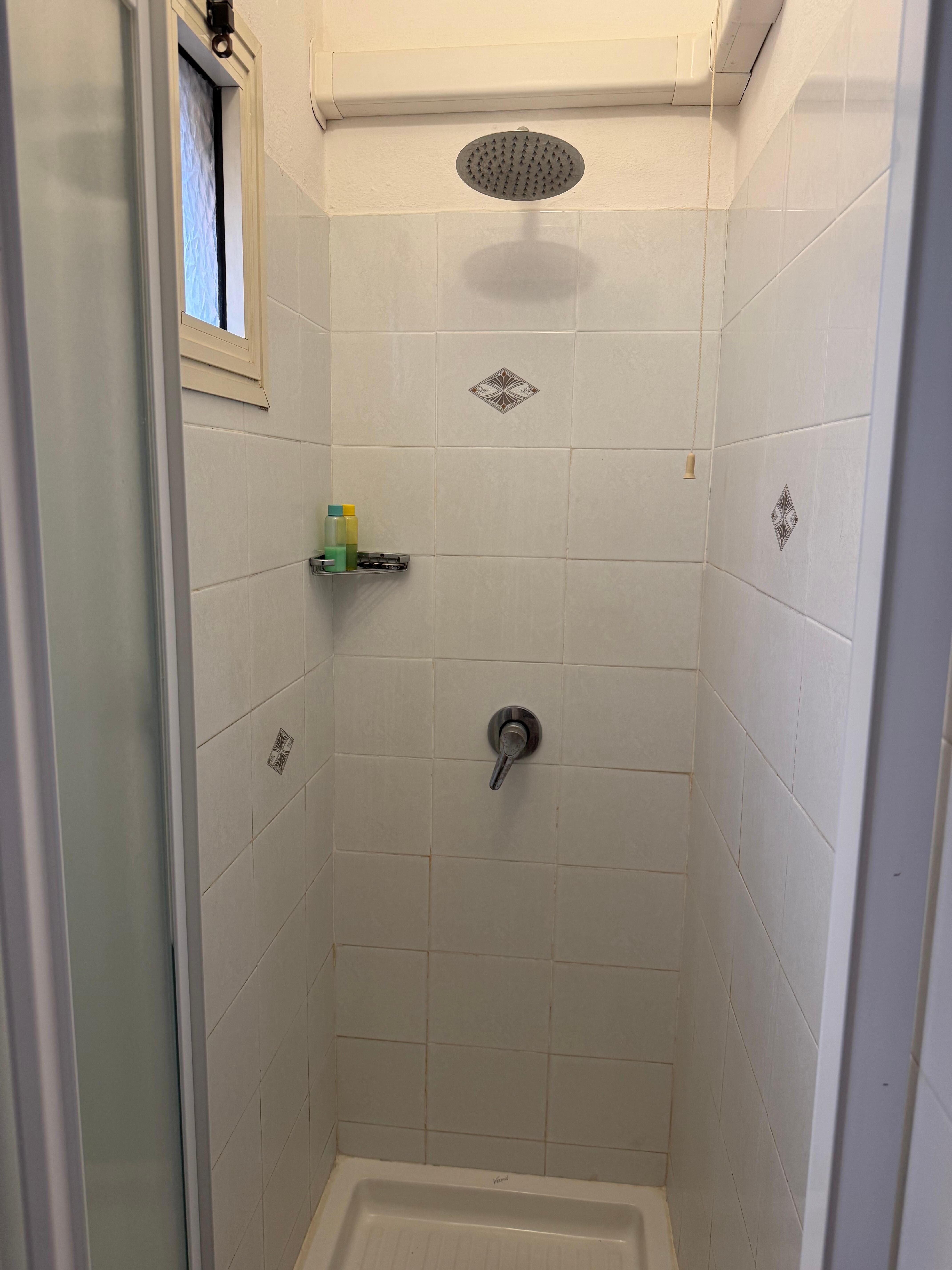 Tiny and unclean shower area