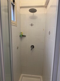 Tiny and unclean shower area
