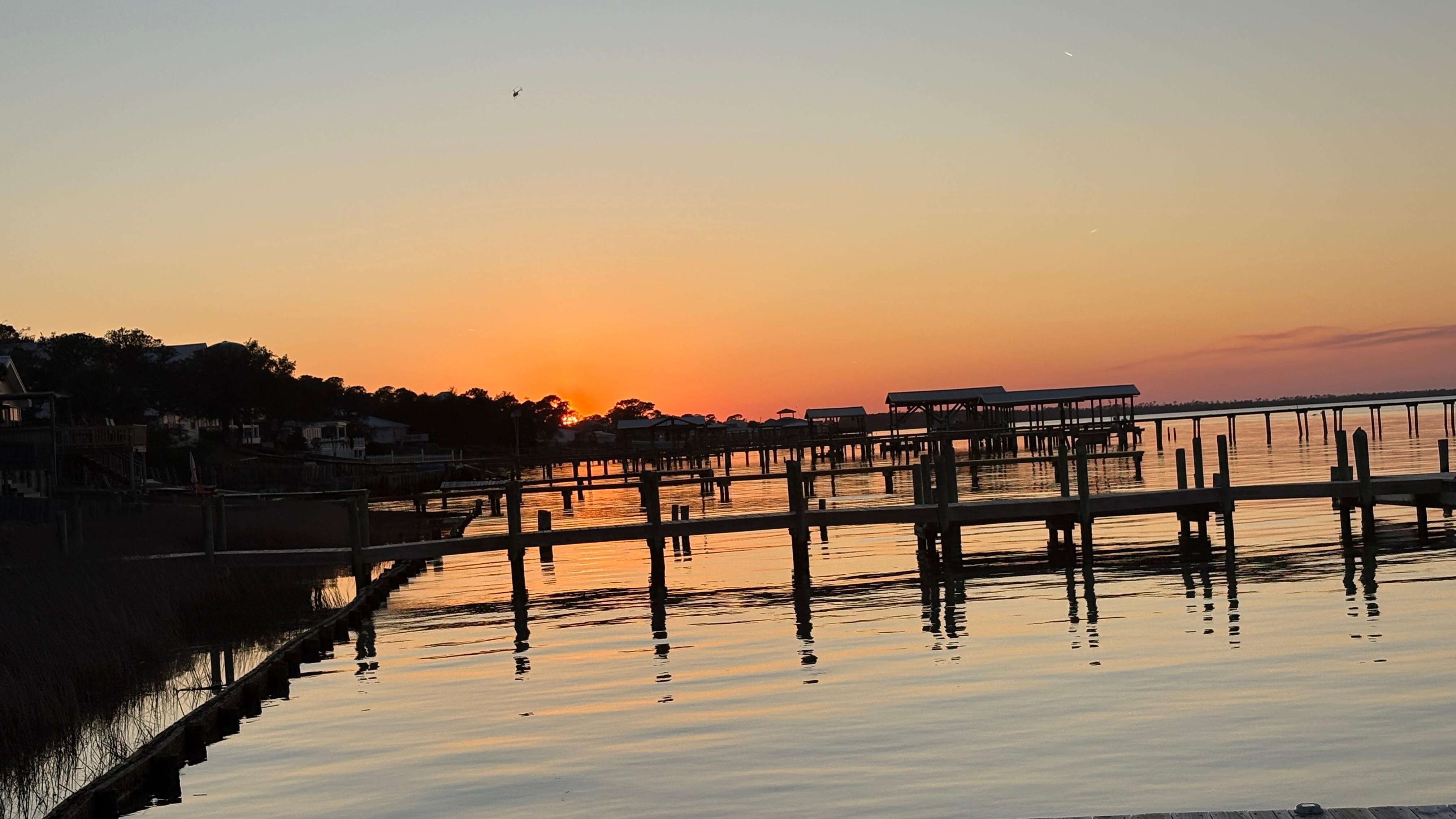 Sunset as viewed from the pier of Waterfront Bay Cabin.