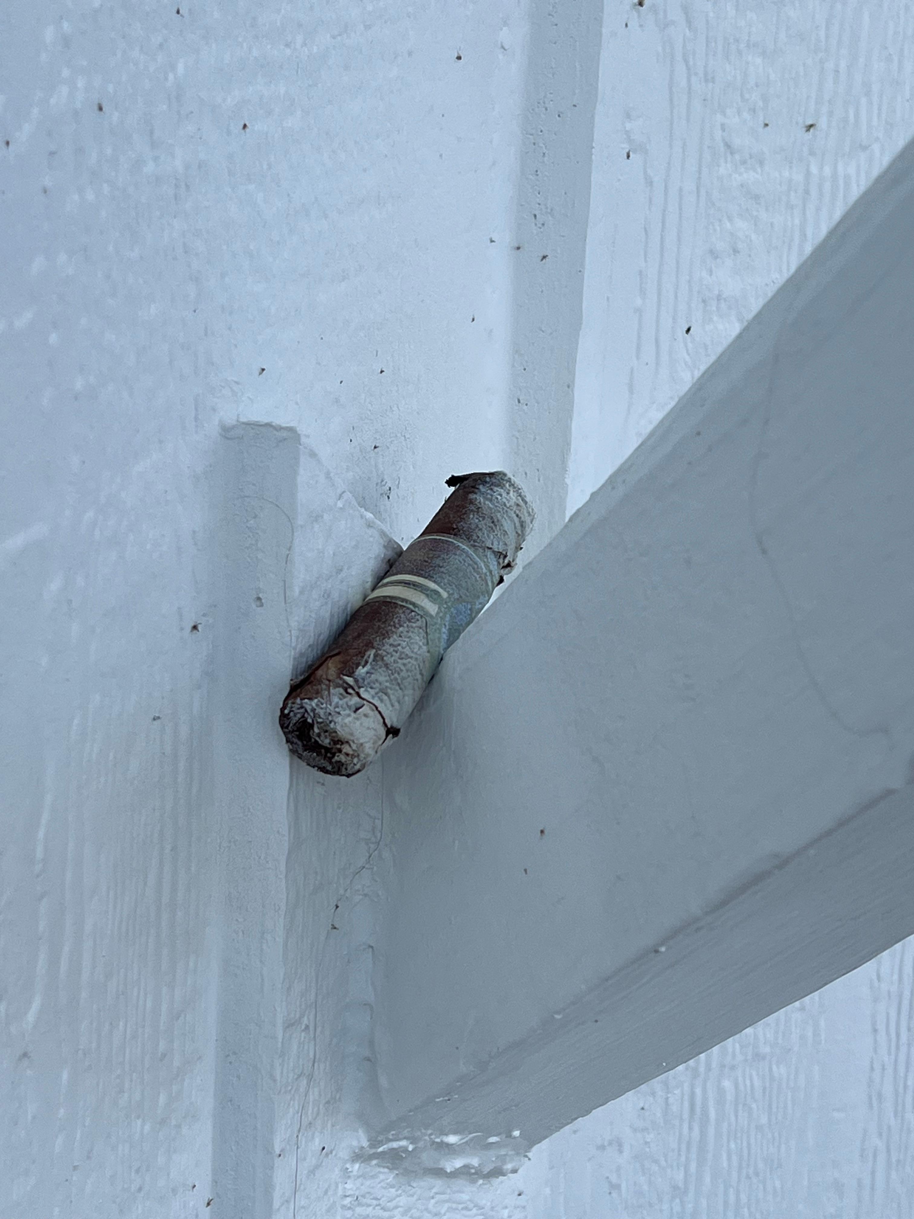 A cigar left and looked like it was spray painted over when they painted the beam.  