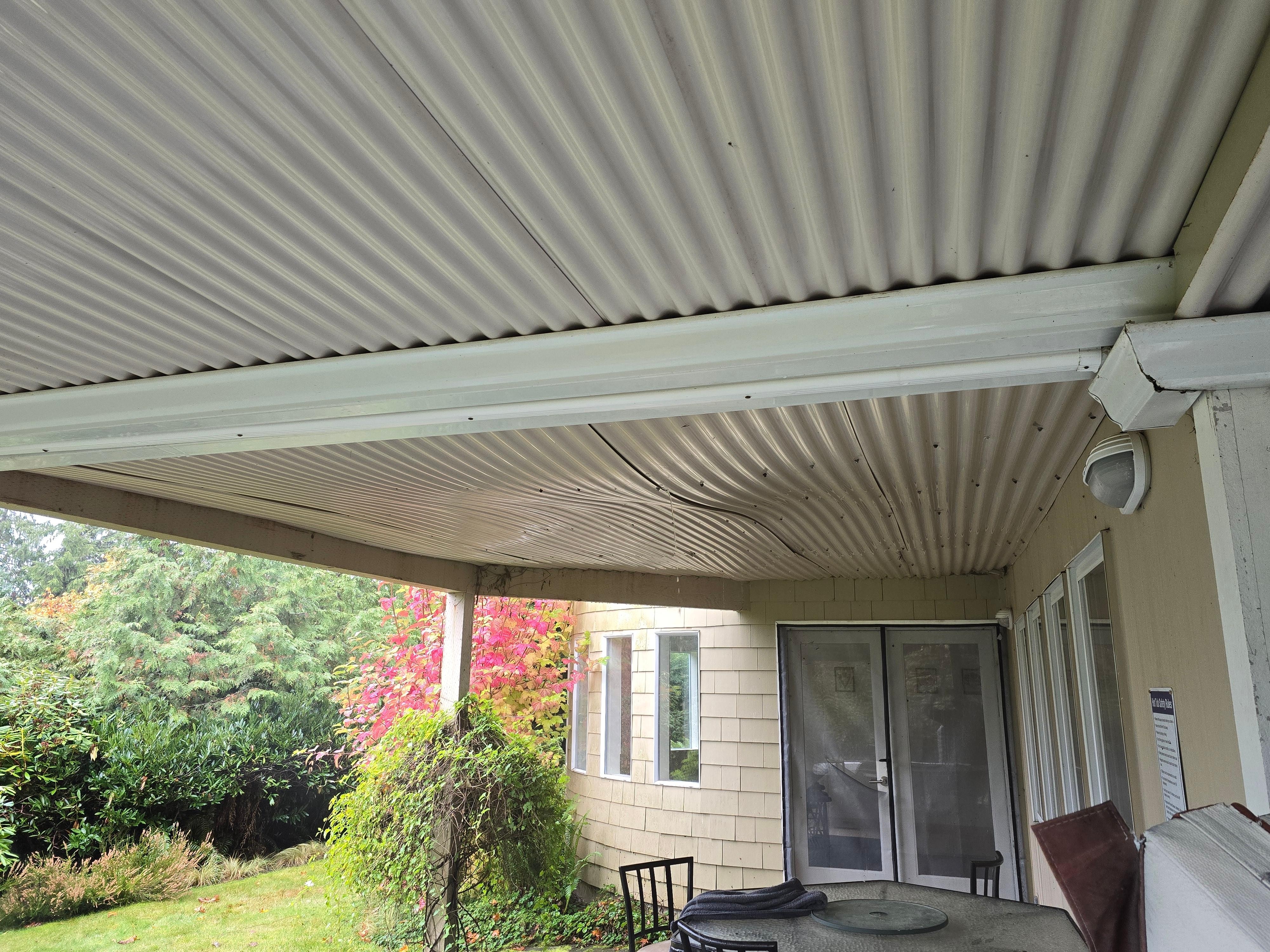 This "ceiling" is missing many screws, and swells until enough water drains out of leaks.  Cool idea...needs reinforcement so it doesnt fall when someone is there