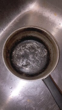 The pot after water evaporated and I got the tea bag's out to the outside trash before I scrubbed the pot