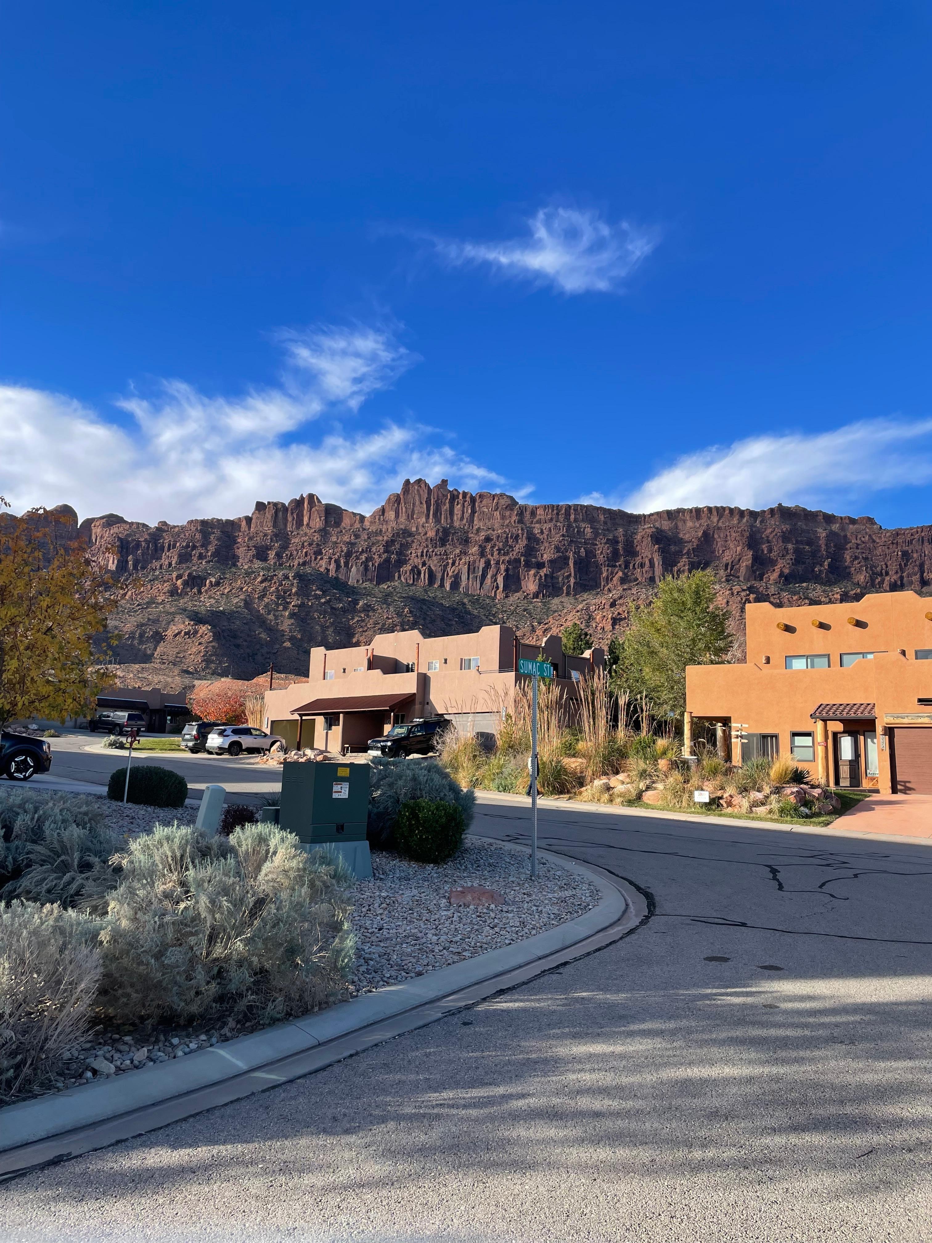 View of condo from road-mountain backdrop.