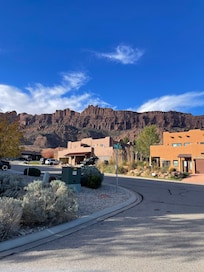 View of condo from road-mountain backdrop.