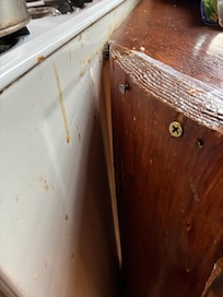 Old food drippings down the stove.