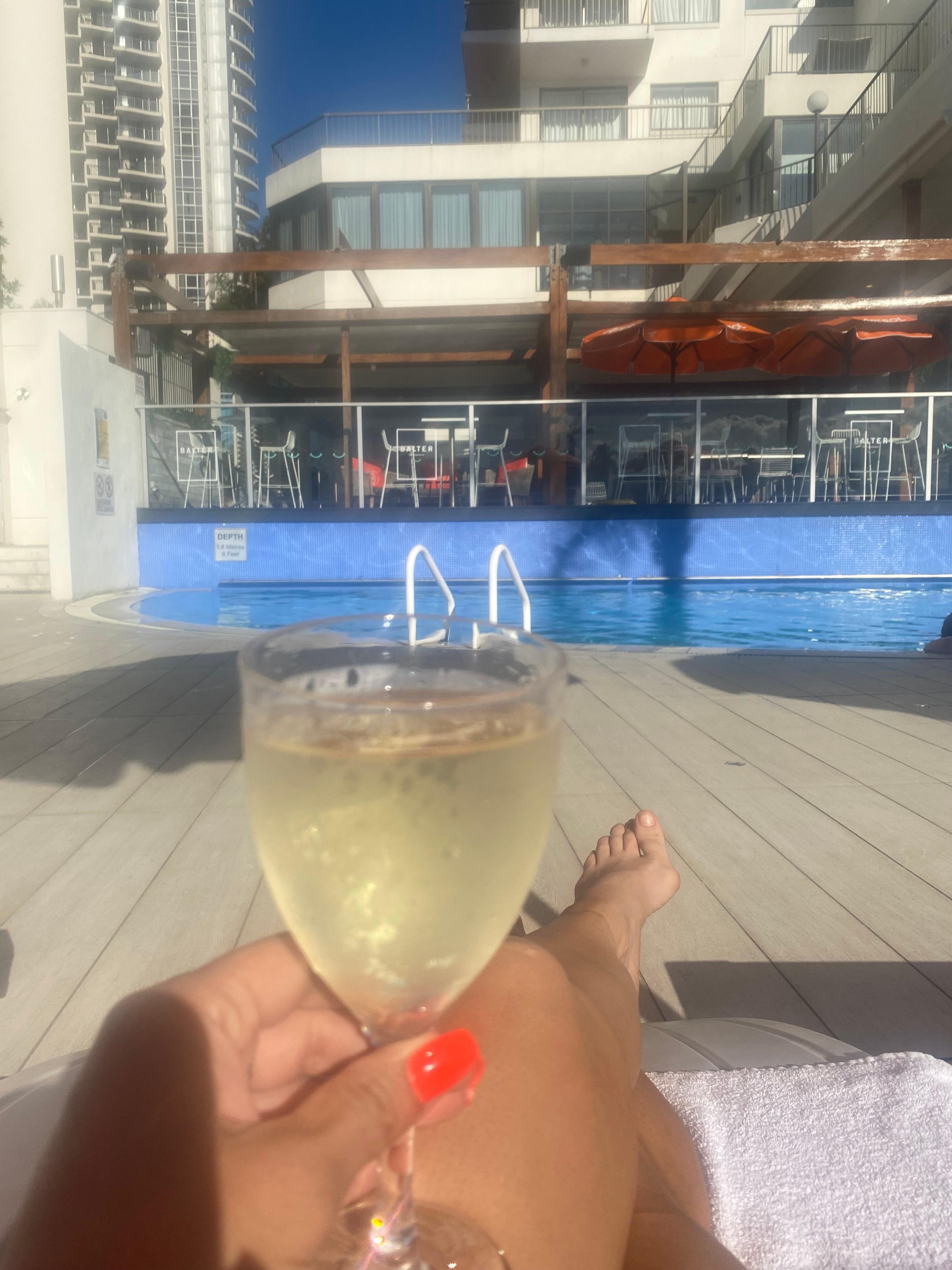 Relaxing with a glass of wine at the pool 