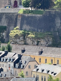 The yellow is the building which backs into the hill
