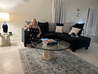 The generous sized living area Is very welcoming and follows the blue and white beachy theme.