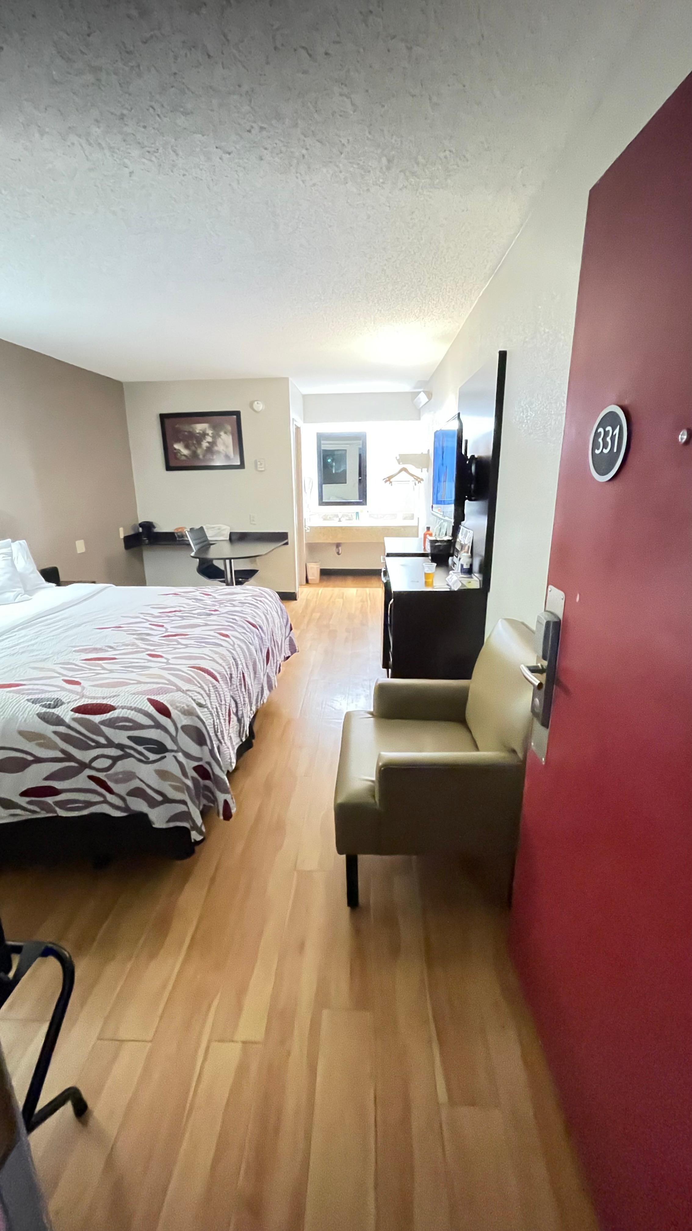 Interior view of the room, it’s large with hard surface flooring. 