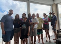 This is our family of 11 on the very spacious wrap around balcony. We loved that it was accessible from every bedroom as well as the living room.